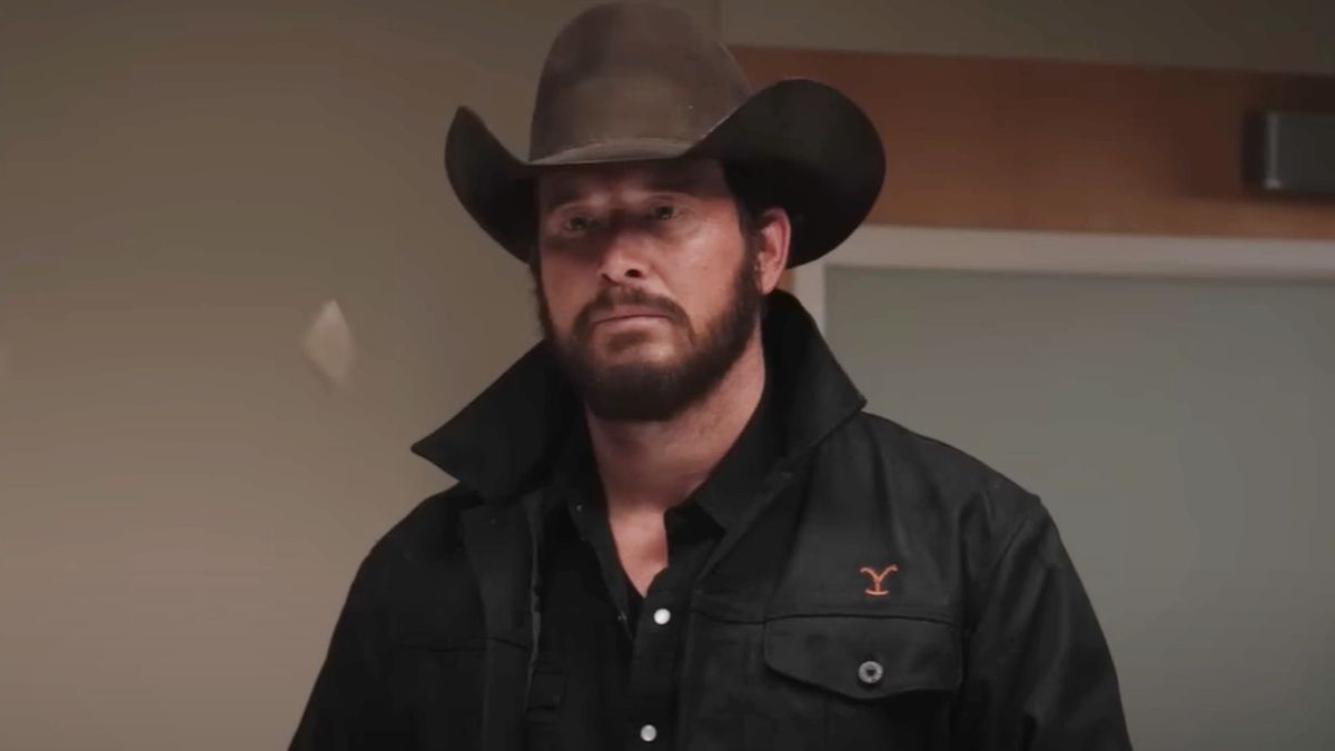 Cole Hauser as Rip standing inside and wearing a cowboy hat in Yellowstone.