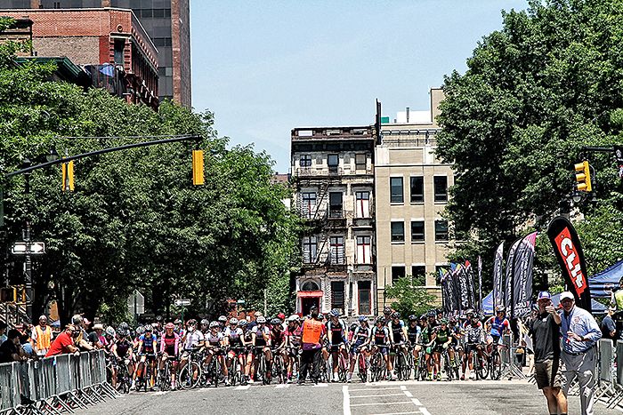 The Women's field stages on 122 Street to start their one mile square crit