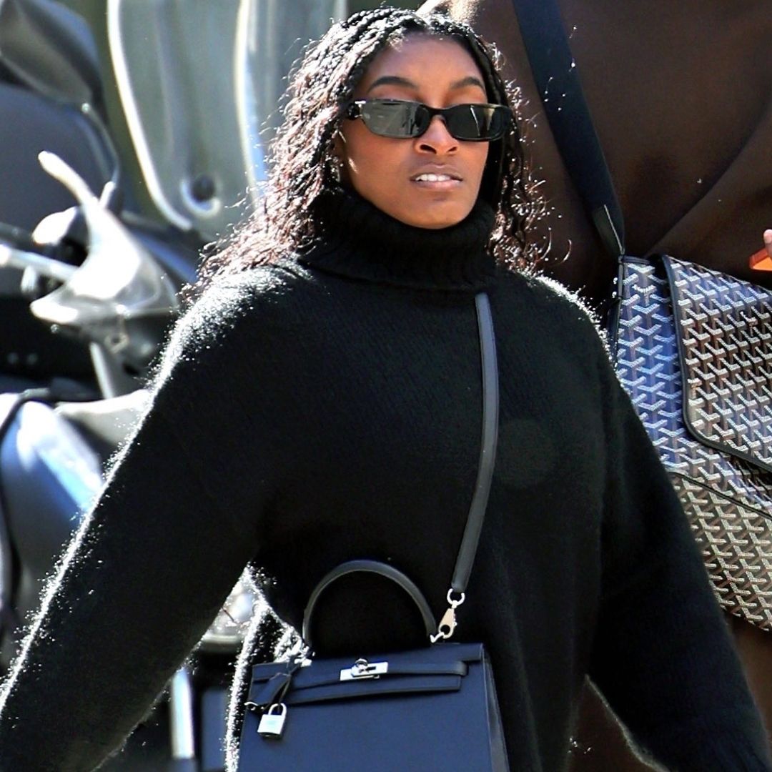 Simone Biles was spotted during the Winter Olympics in Milan wearing Nike sneakers and a Herm&egrave;s Kelly bag