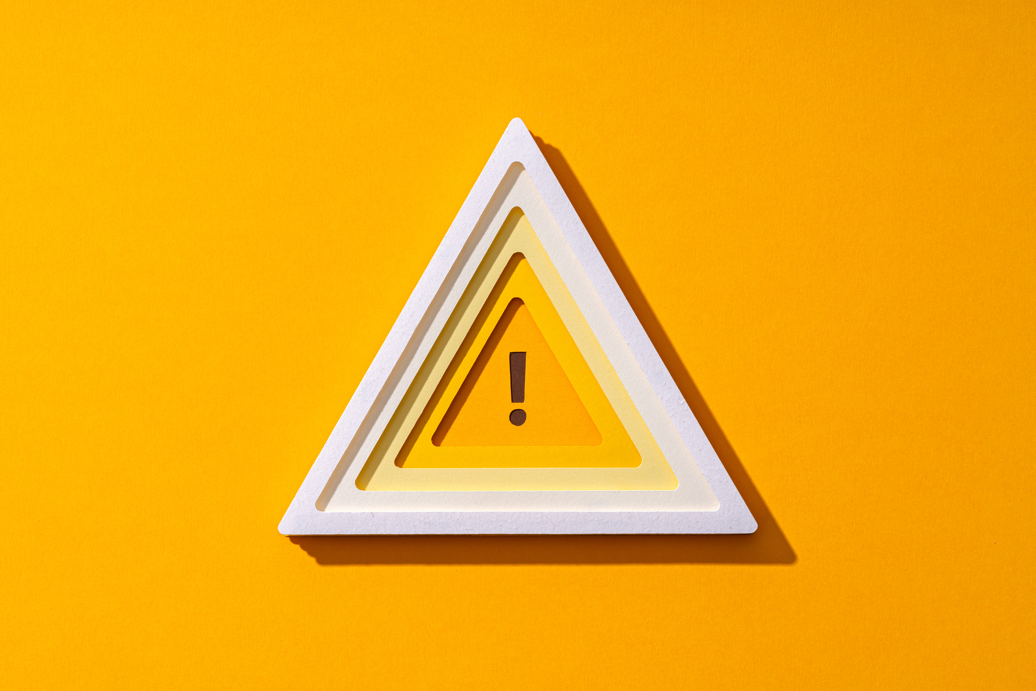 Paper Craft Yellow Warning Sign on Yellow Background Front View.