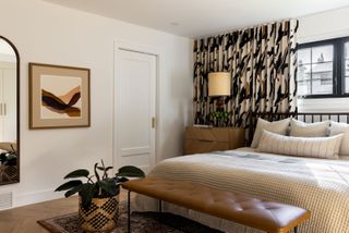 a bedroom with patterned curtains