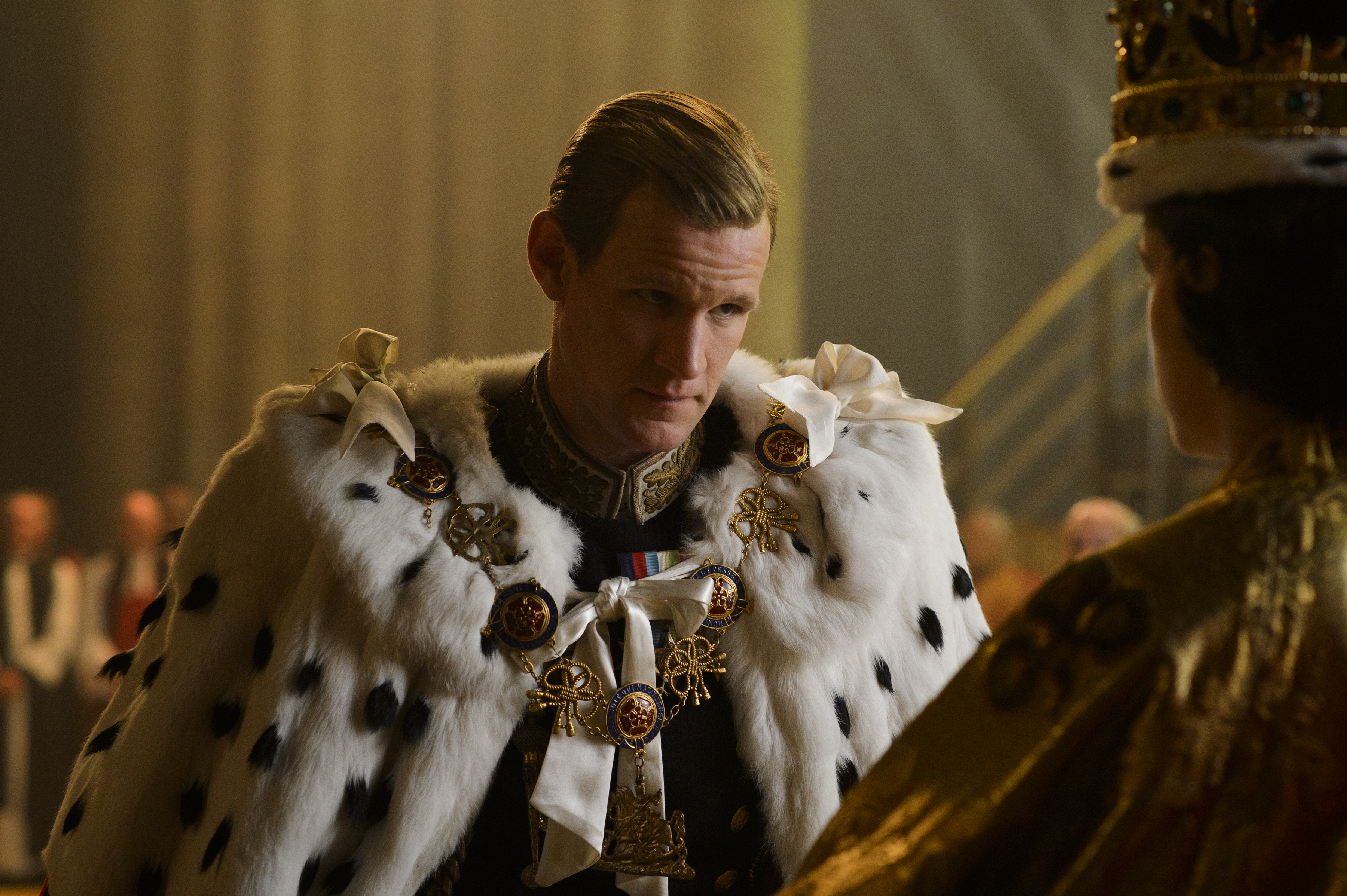 Matt Smith as Prince Philip in the Crown, wearing a fur cape