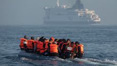 An inflatable boat carrying migrants 