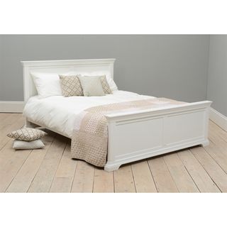 White Chantilly king-sized bed with white and neutral bedlinen