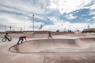 skaters at La Duna pink concrete skatepark