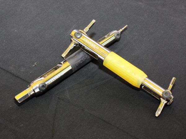 The handy ToolStick 11 and 22 includes four commonly used tools each with pivoting heads and long handles for leverage.