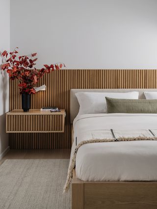 modern bedroom with wood slatted headboard