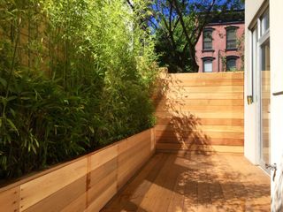 a small garden deck made from cedar