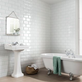 bathroom with white tiles and bathtub