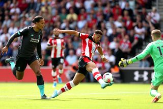 Che Adams, centre, shoots unsuccessfully against Liverpool