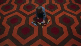 Danny Torrance on the rug in the Overlook in The Shining