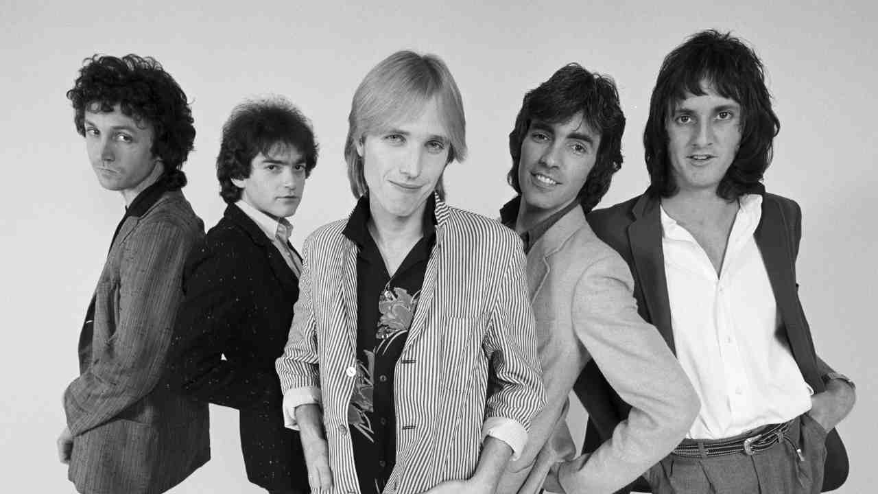 Tom Petty & The Heartbreakers posing for a photograph in the early 1980s
