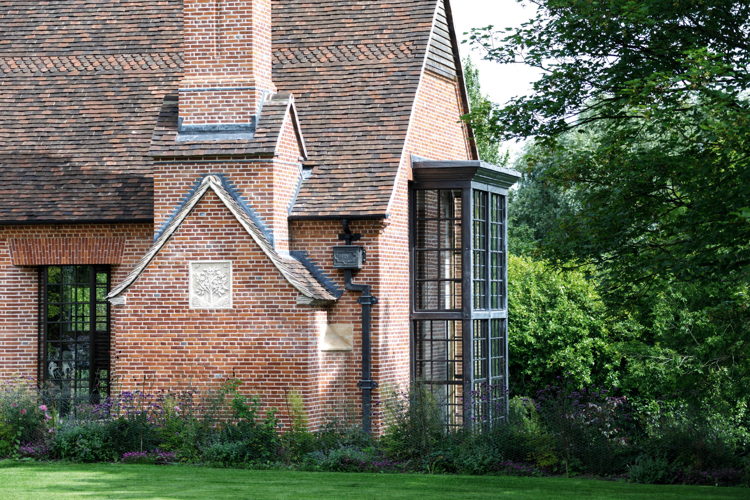An Arts-and-Crafts-style red-brick extension to a late-17th-century listed house in Worcestershire, designed by the Cotswold-based architectural practice Yiangou &amp;mdash; Country Life Top 100 2026