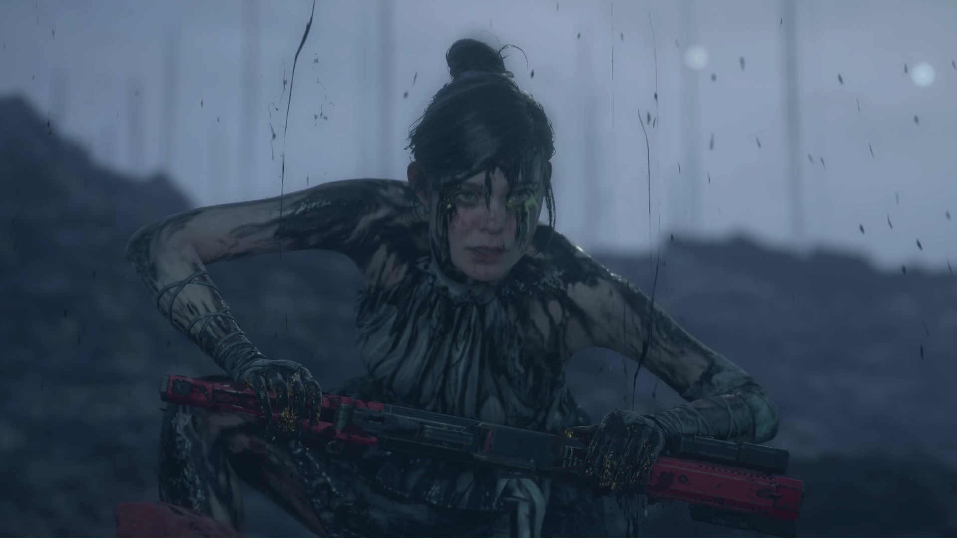 Tomorrow holds an assault rifle while covered in tar in Death Stranding 2