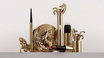 Isamaya Wild Star rodeo-themed make-up collection with make-up products in gold and rhinestones