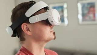Wearing a Meta Quest 3 with a Kiwi Design halo headstrap and no facial interface