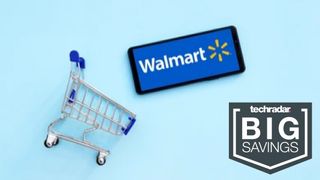 Walmart logo on a phone next to a shopping trolley