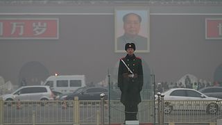 BEIJING, CHINA - JANUARY 16:(CHINA OUT) A Chinese policeman stands guard on the Tiananmen Square which is shrouded with heavy smog on January 16, 2014 in Beijing, China. Beijing Municipal Gov