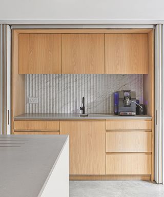 Marble kitchen backsplash with wood cabinets