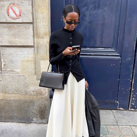 @sylviemus_ street style in black high neck jacket and white skirt