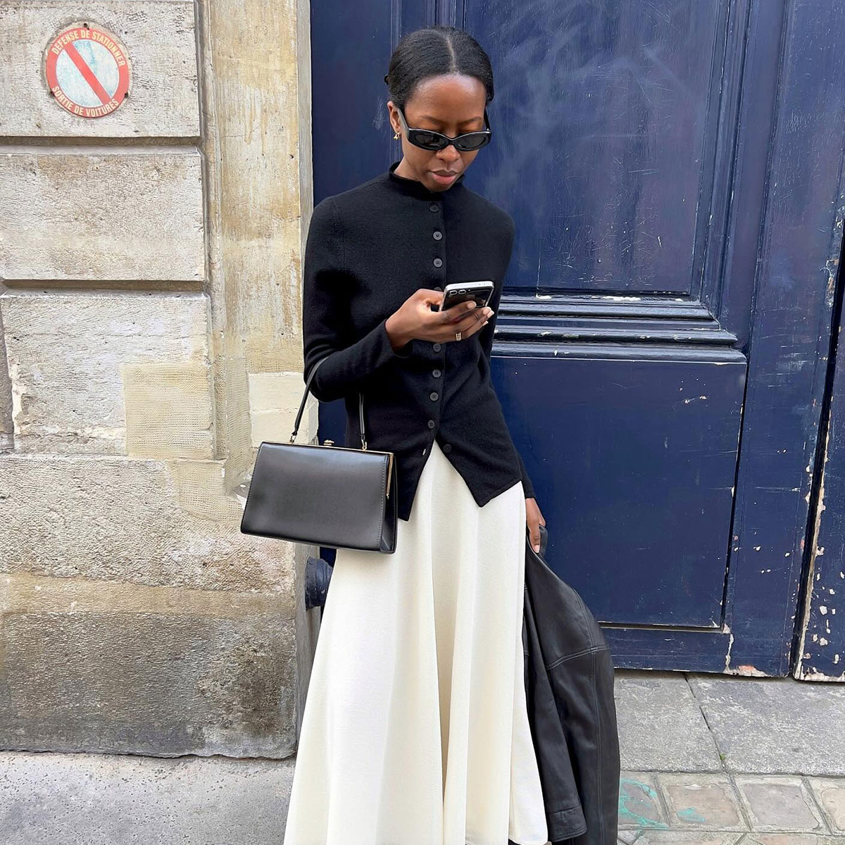 @sylviemus_ street style in black high neck jacket and white skirt