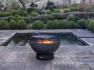 Fire pit idea as a BBQ on a paved patio