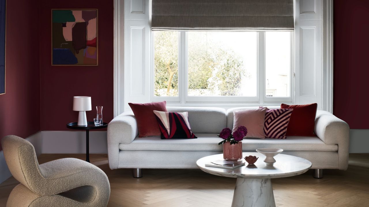 Cherry mocha painted walls in living room with neutral and white decorative accents