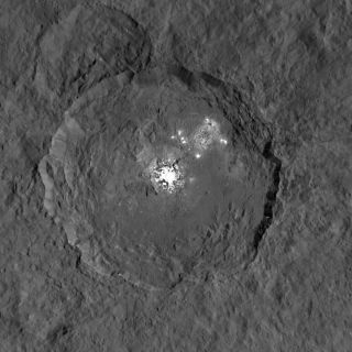 A close-up view of a strange bright spot in Occator crater on the dwarf planet Ceres, as seen by NASA's Dawn spacecraft. Observations of from ground-based telescopes suggest the spots undergo daily changes.