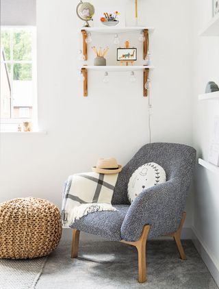 Light grey nursery with grey armchair