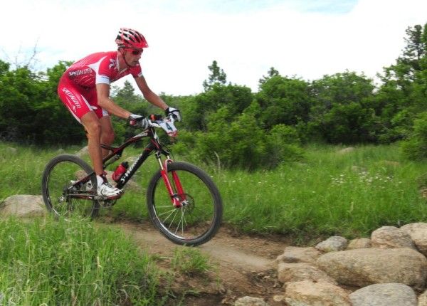 Todd Wells (Specialized) descends over a rock bridge.