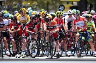 The riders congregate on the stage 6 start line in Adelaide