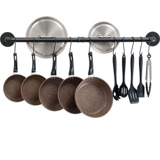 metal rail with hooks for hanging pots and pans and utensils