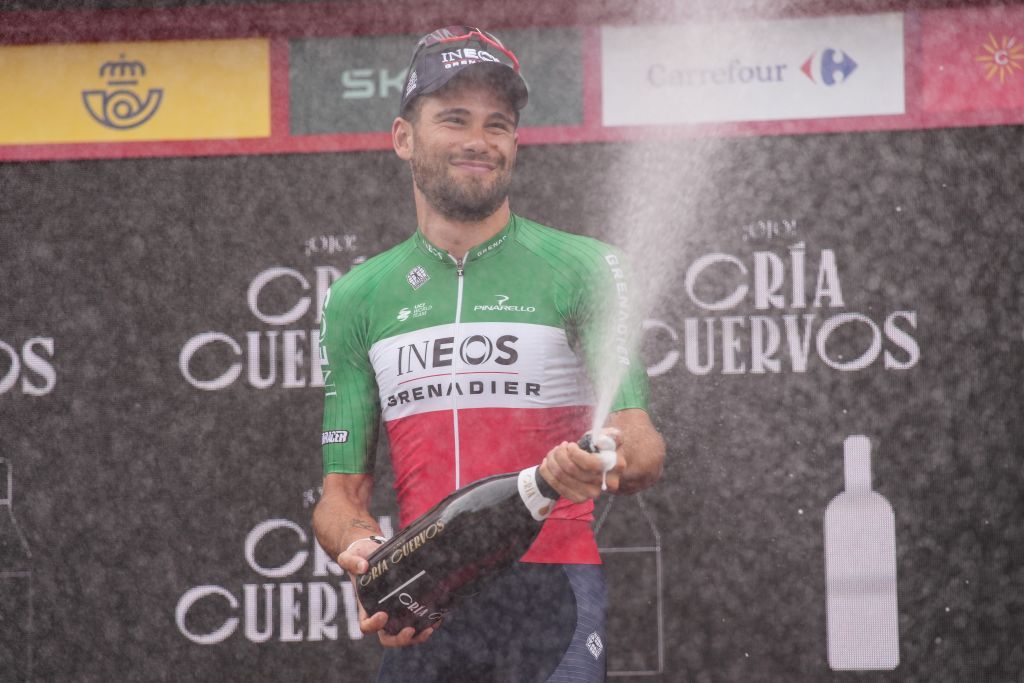 Team Ineos Italian rider Filippo Ganna celebrates on the podium after winning the stage 10 of the 2023 La Vuelta cycling tour of Spain a 258 km individual time trial in Valladolid on September 5 2023 Photo by CESAR MANSO AFP Photo by CESAR MANSOAFP via Getty Images