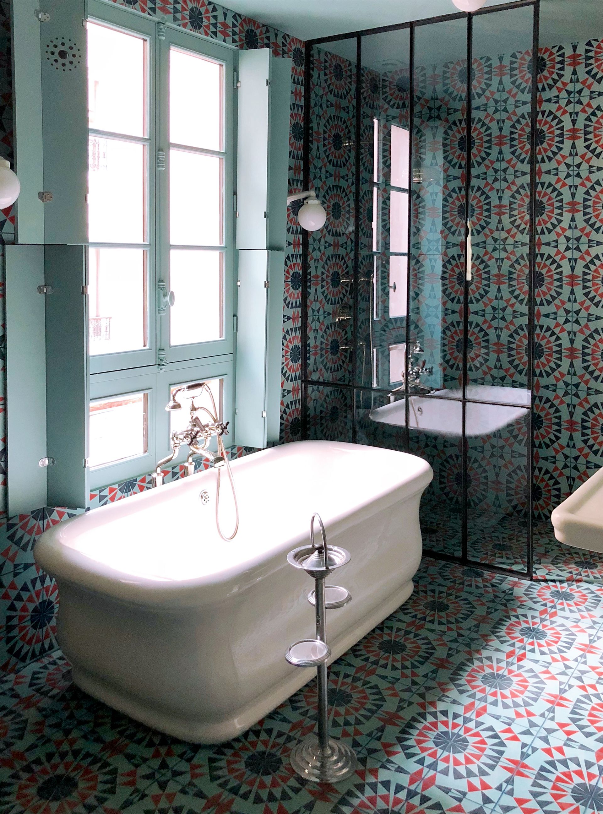 Bathroom with tiles and freestanding bath