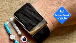 Whoop band on wearers wrist with savings squad badge