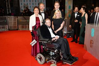 Stephen Hawking with Jane Wilde Hawking Jones (left) and guests attend the EE British Academy Film Awards at The Royal Opera House on Feb. 8, 2015 in London, England.