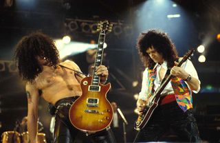 Slash & Brian May performing on stage at the Freddie Mercury Tribute concert