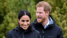Podcasting: Meghan, Duchess of Sussex participates in wellie wanging with Prince Harry, Duke of Sussex as they visit the North Shore