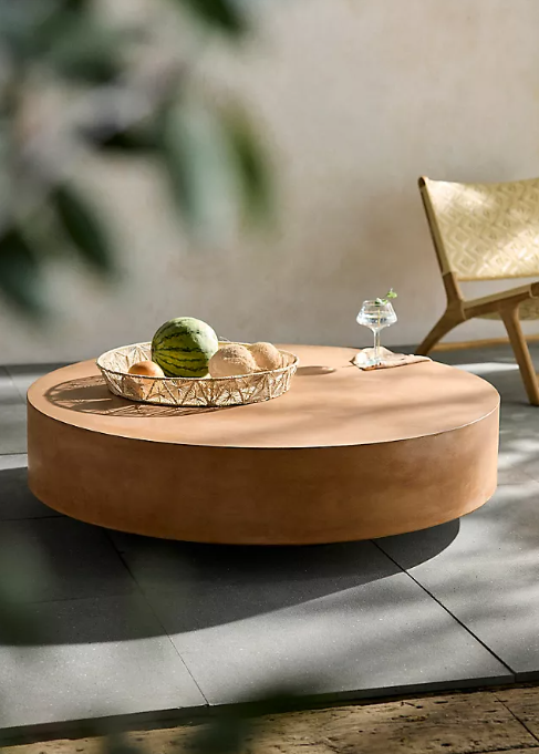 Round concrete outdoor coffee table.