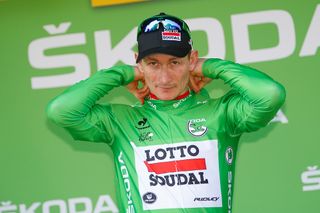 Andre Greipel back in green on the stage 6 podium.
