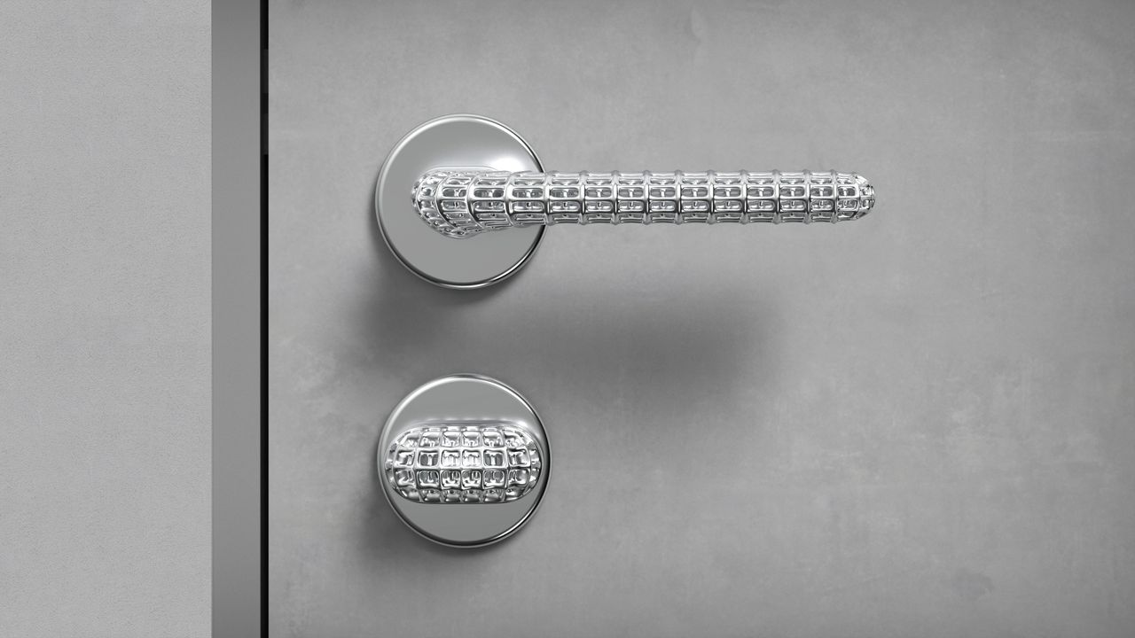 silver door handle on grey door