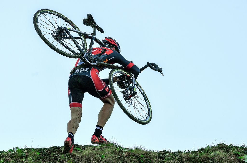 A rider arrives at the top of the steep climb