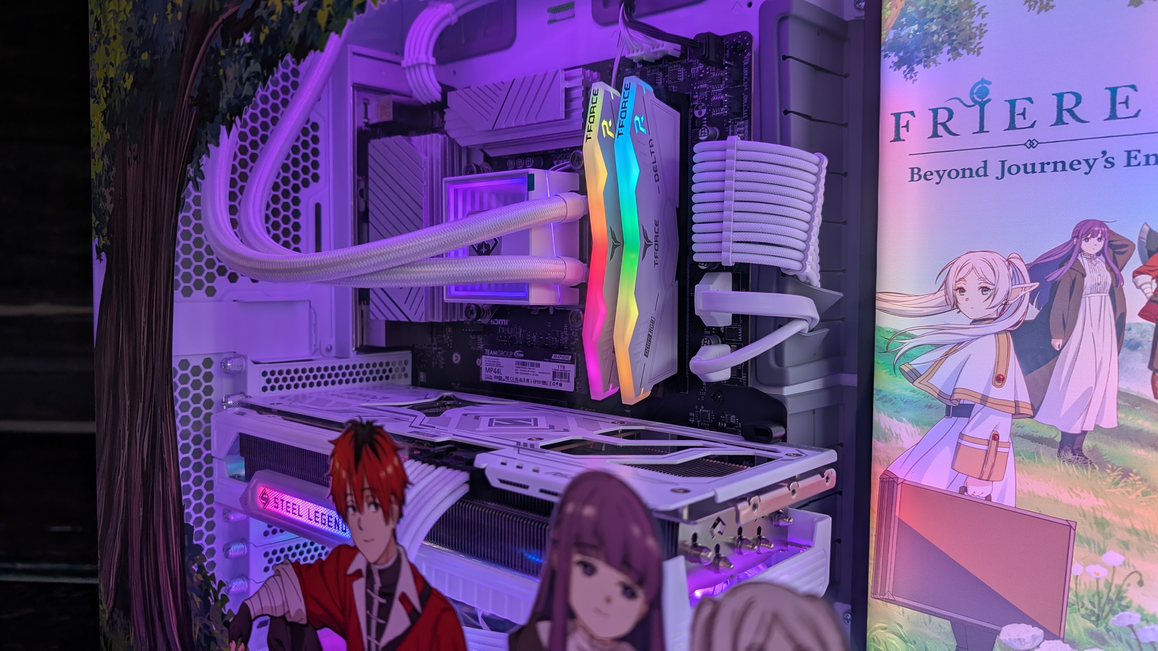 The Starforge Systems Frieren PC, photographed on a dark worktop with the RGB lighting switched on.