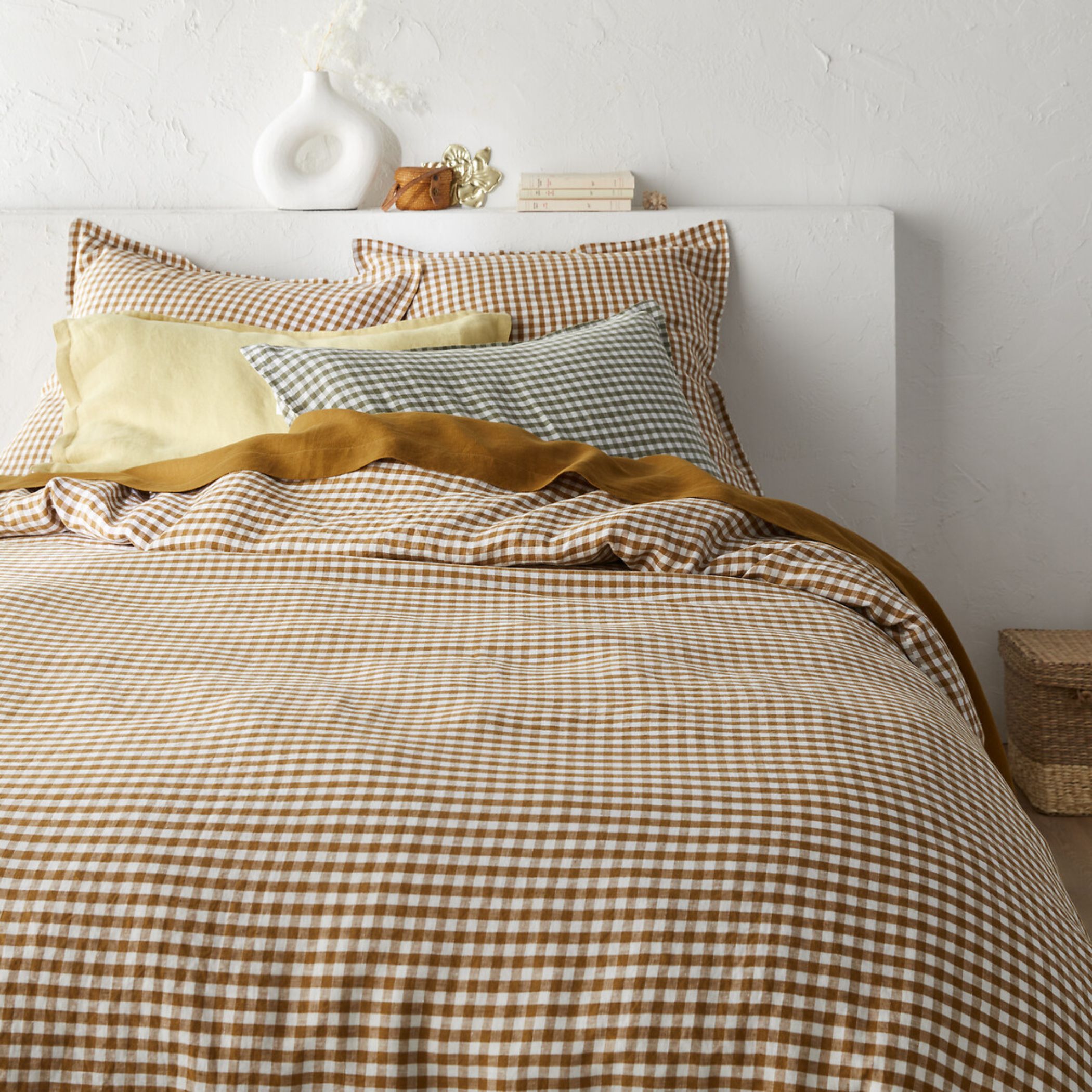 gingham bedding in a mix of different colors on a bed