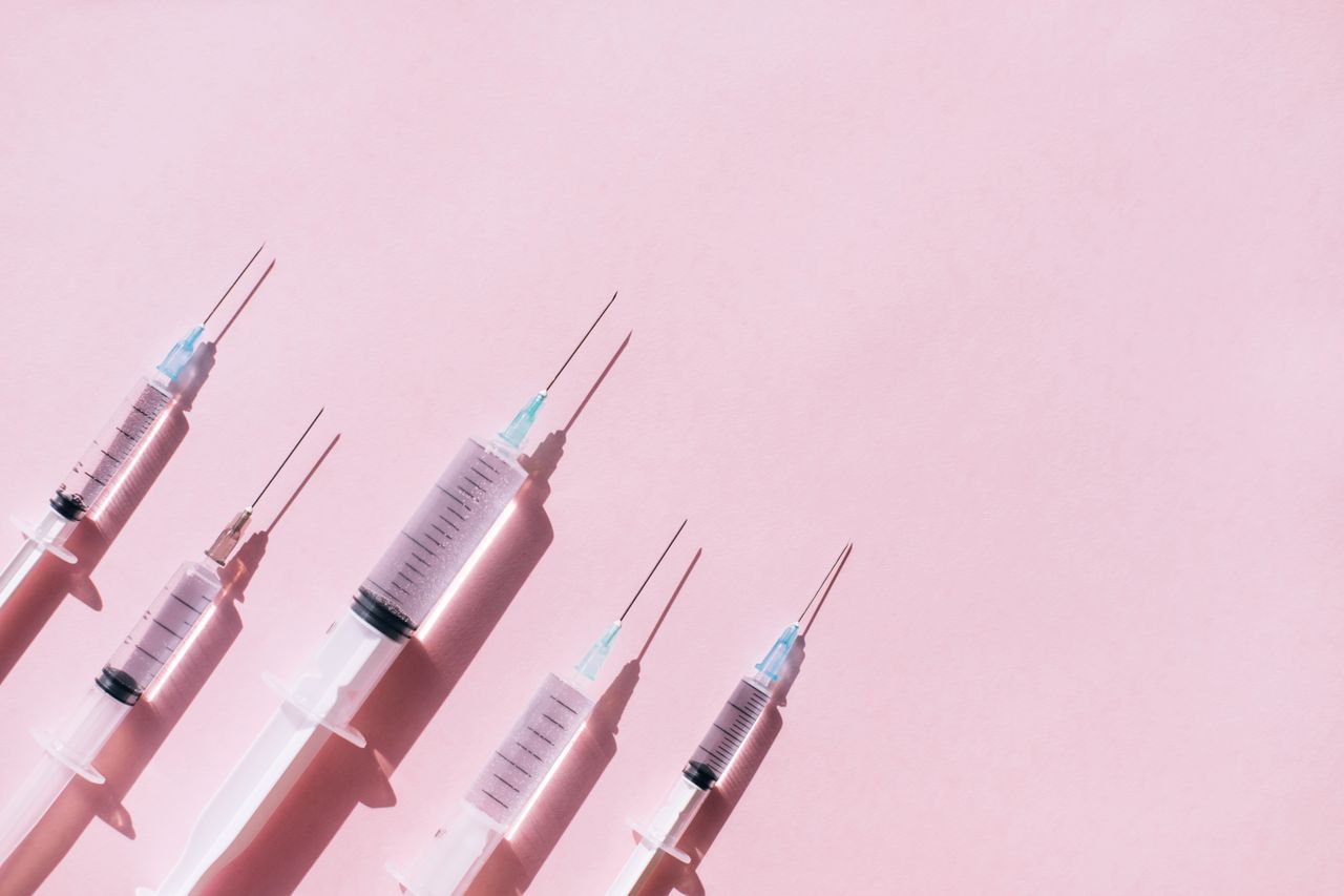 pink background with four botox needles