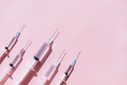 pink background with four botox needles