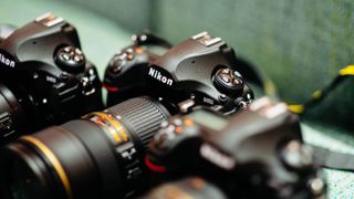 Nikon cameras on green background