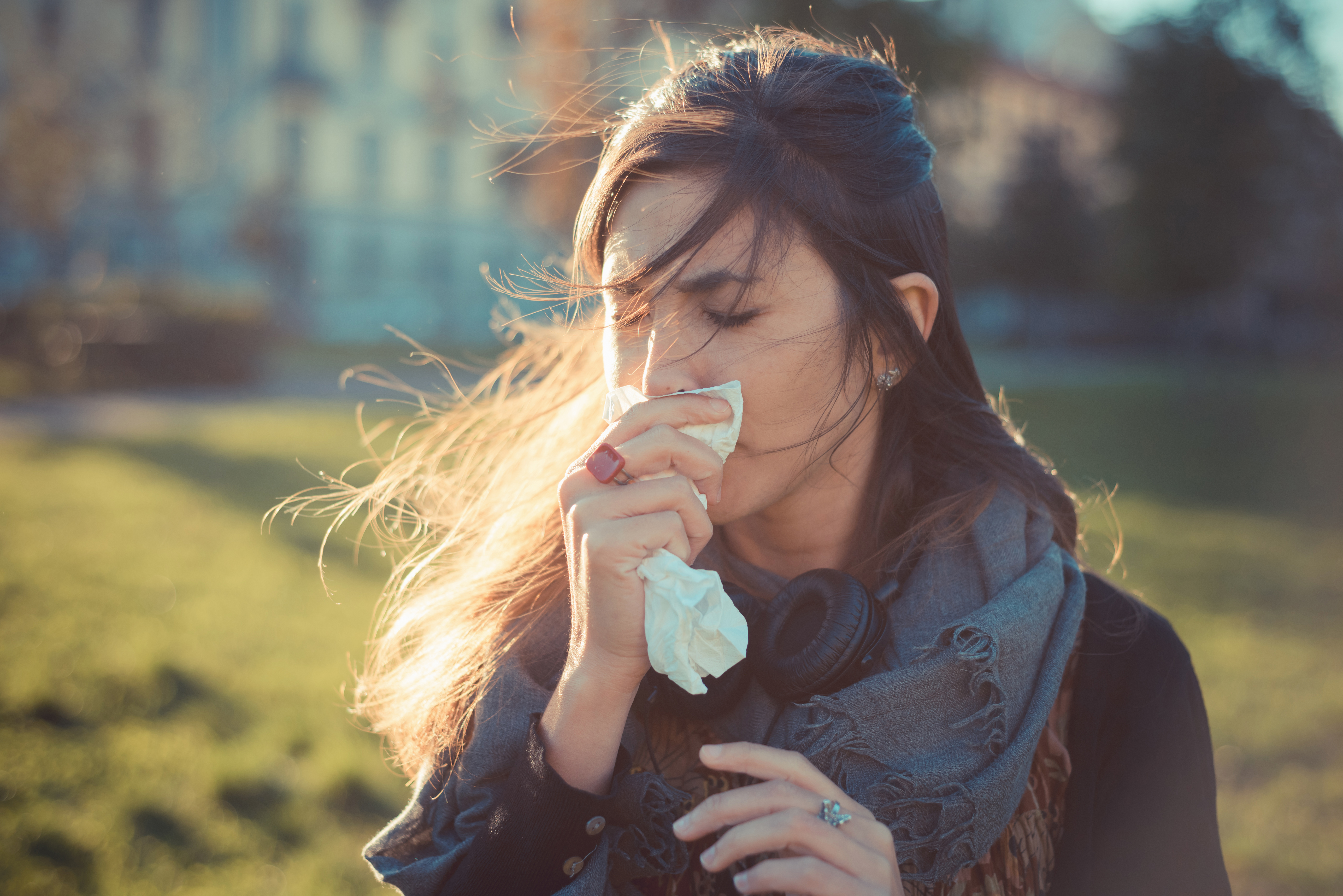 Woman blowing nose