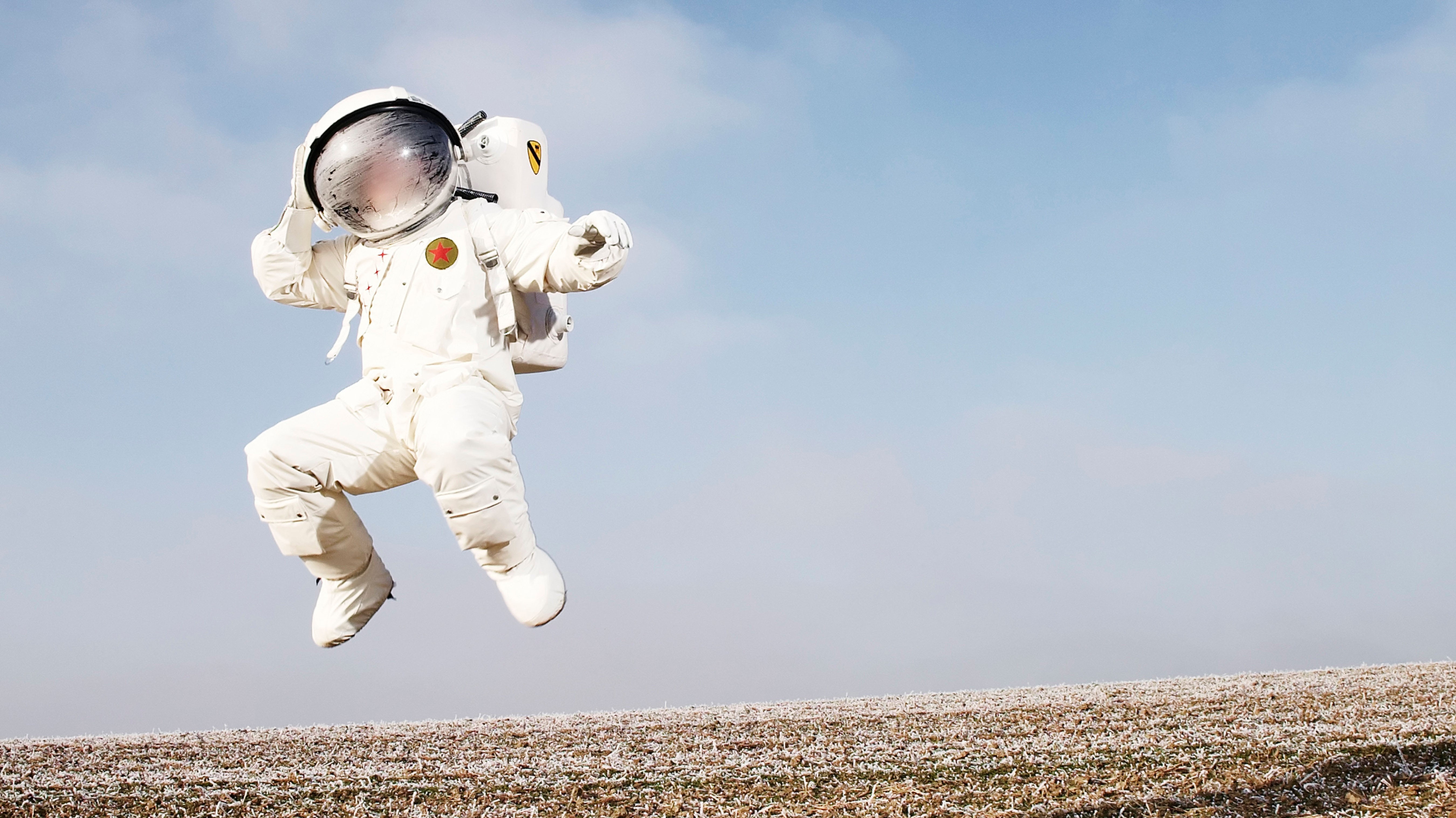 Group of kids jump high over blue sky and clouds, Stock image