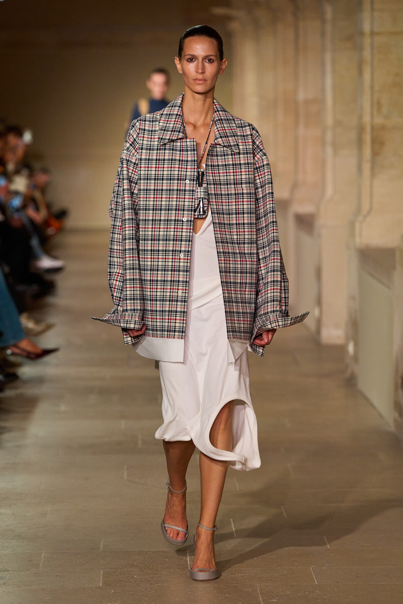 An image of a checked jacket, one of the biggest spring jacket trends, on the Victoria Beckham spring/summer 2026 runway.
